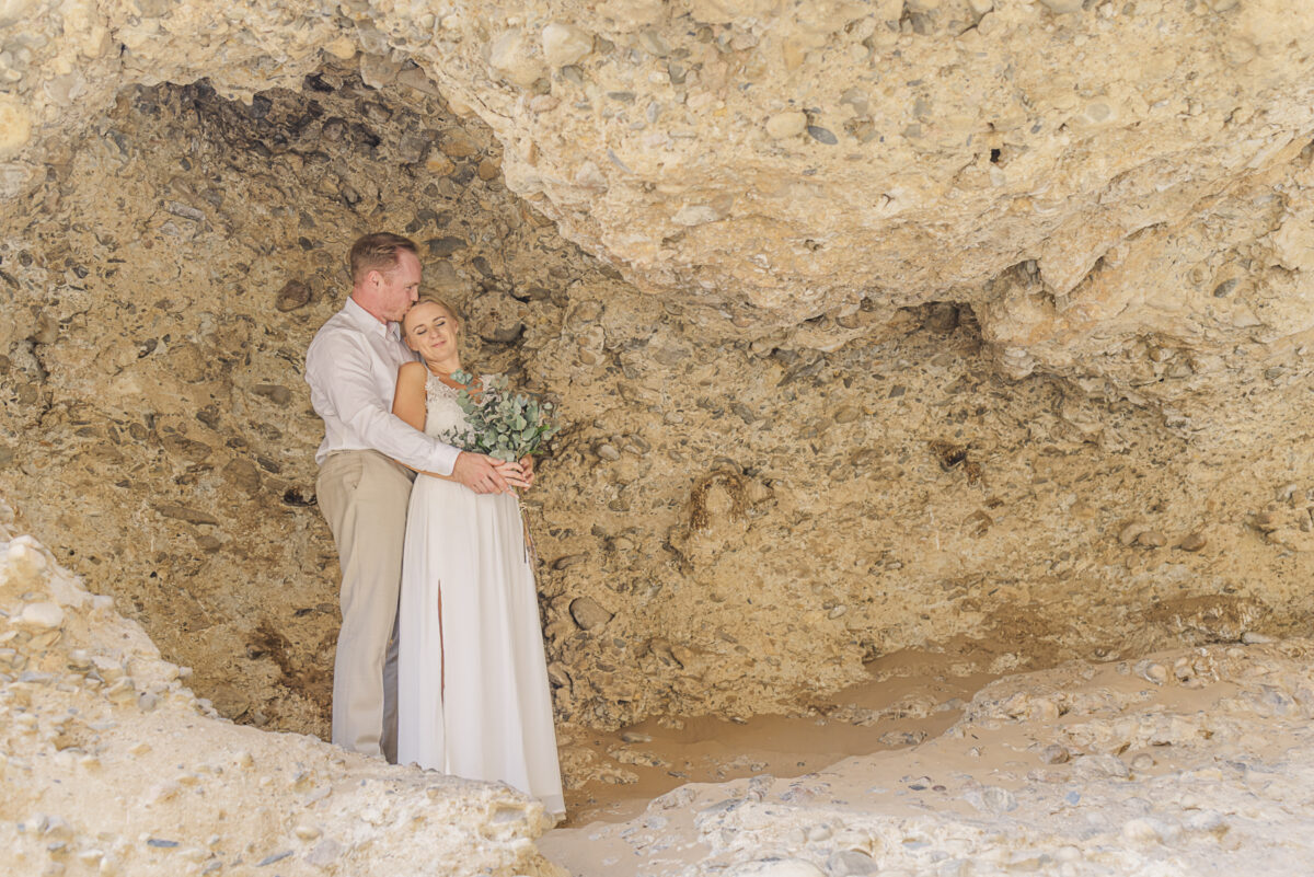 Couple during wedding photos in Sesriem Canyon, Namibia, image by Mariette du Toit Photography