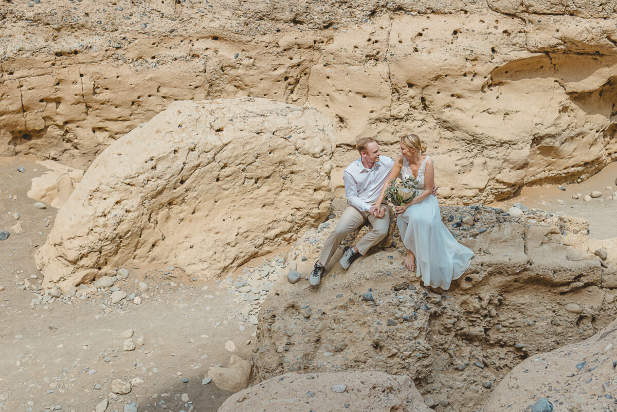 Couple during wedding photos in Sesriem Canyon, Namibia, image by Mariette du Toit Photography
