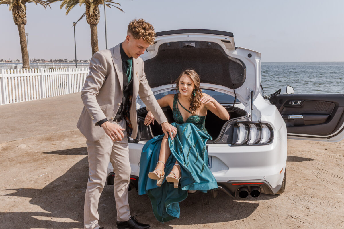 boy and girl with ford mustang at walvis bay lagoon during matric photos by mariette du toit photography