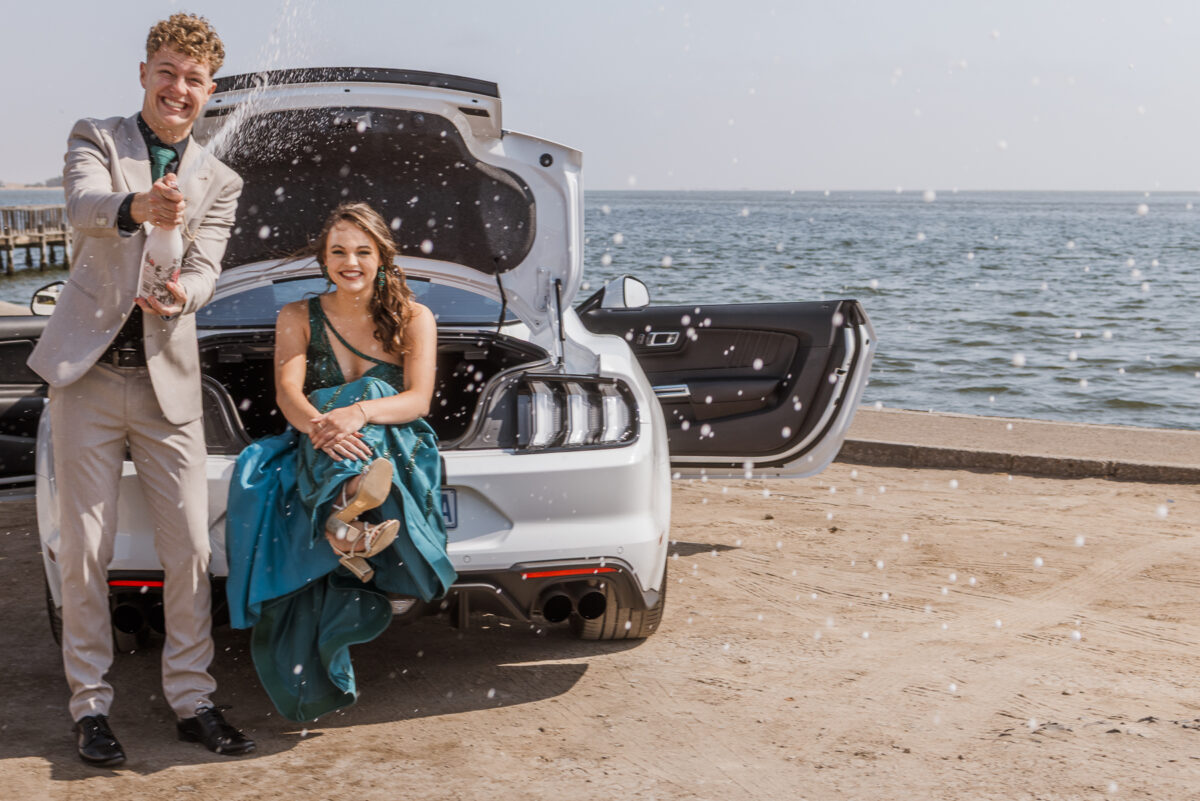 boy and girl with ford mustang at walvis bay lagoon during matric photos by mariette du toit photography