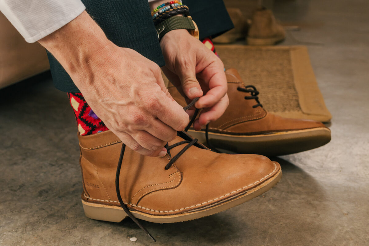 intimate-wedding-details-at-desert-camp-sossusvlei_groom-prepping-image-by-mariette-du-toit-photography