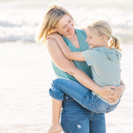 mother and daughter on beach in jeffreys bay south africa