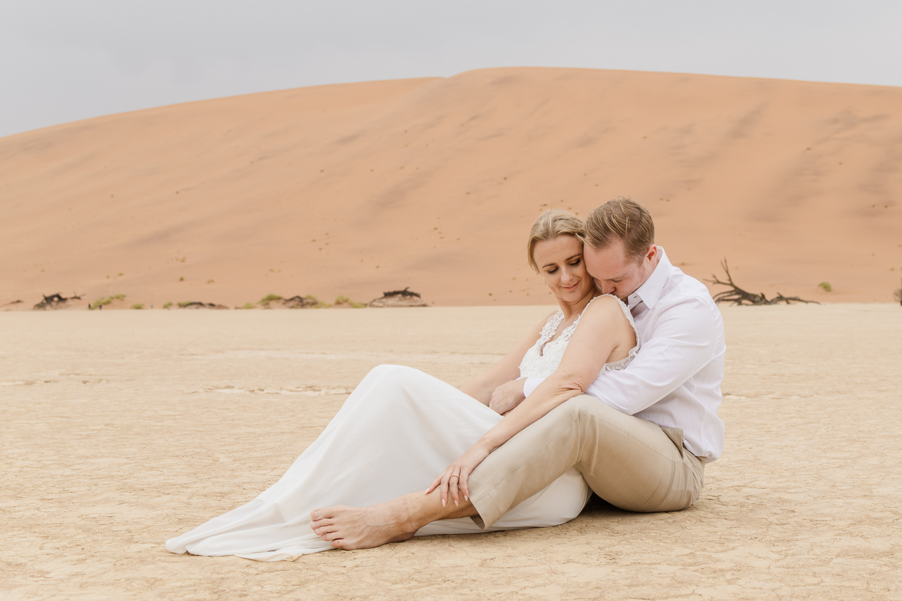 couple enjoying a moment during namibia elopement in sossuvlei