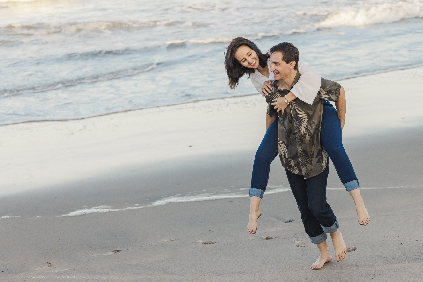 couple playing on swakopmund beach namibia