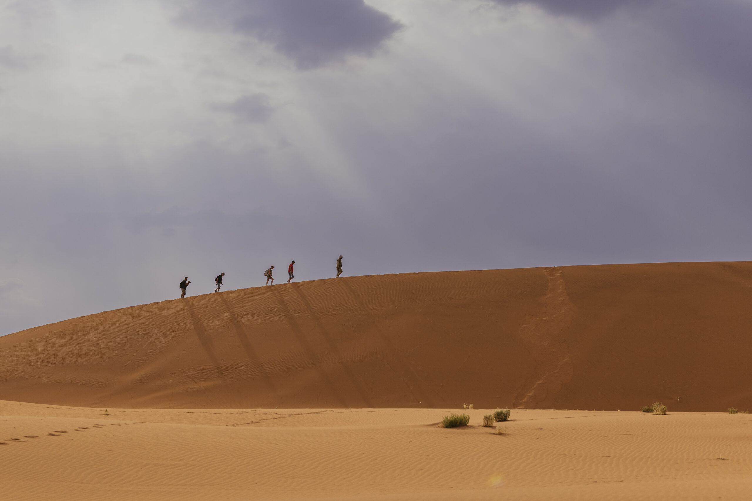 family walking in sossusvlei dunes
