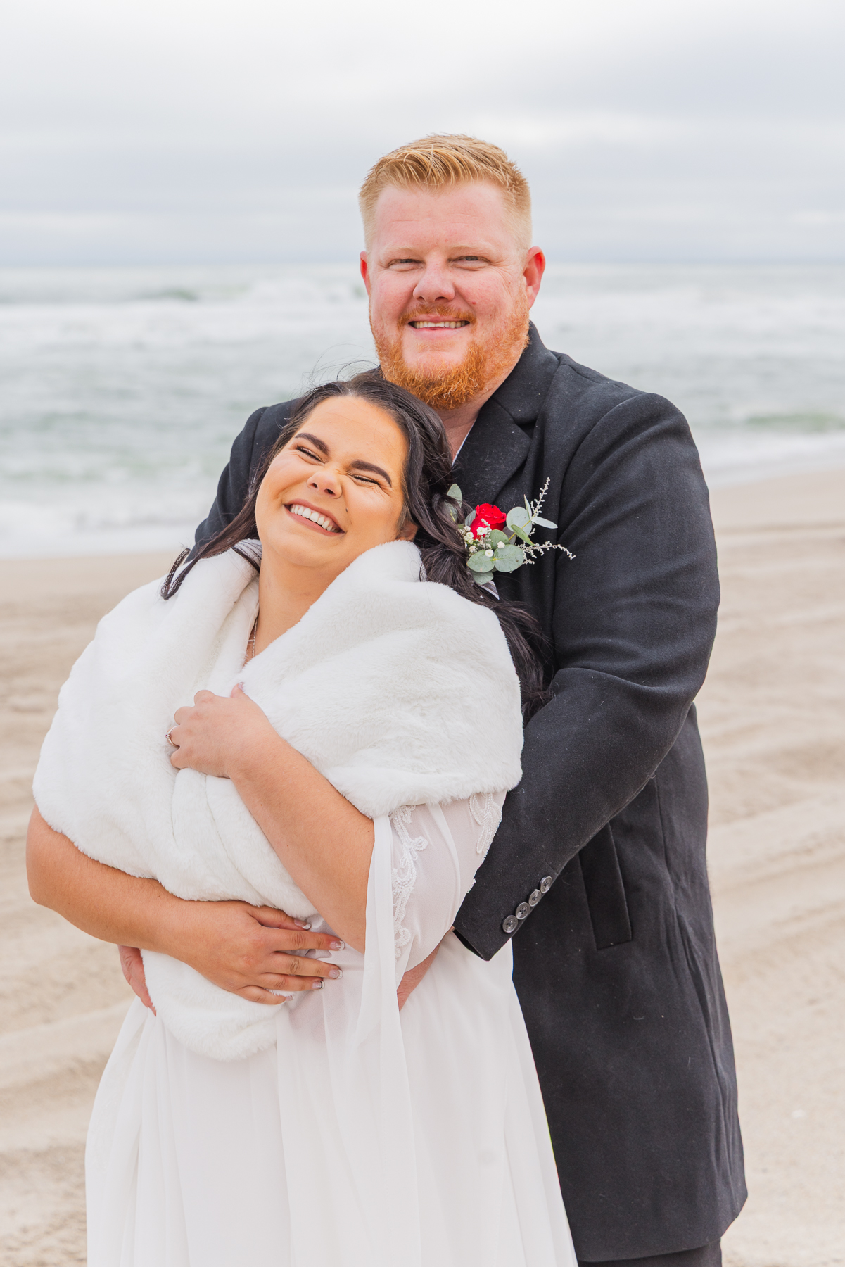 wedding couple walking on Henties beach