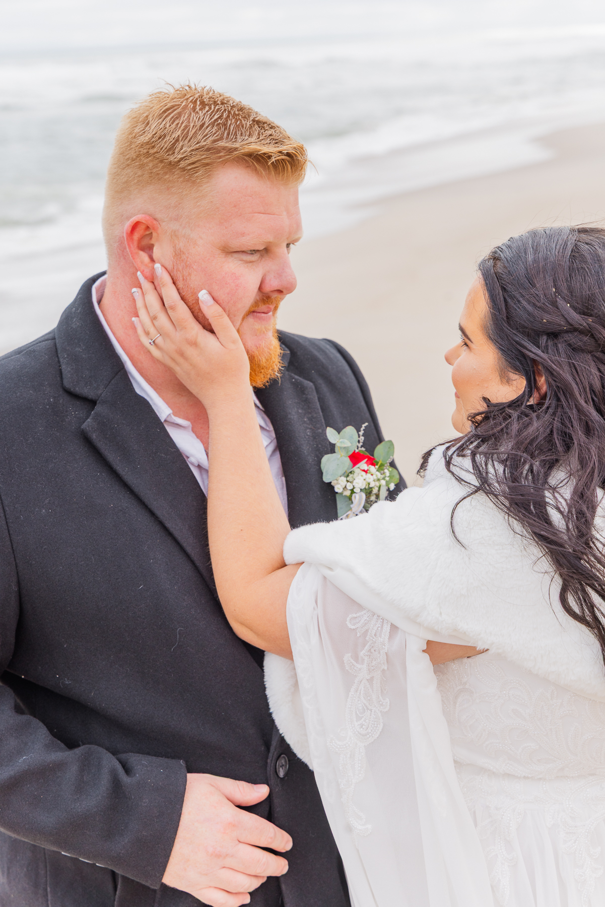 wedding couple walking on Henties beach